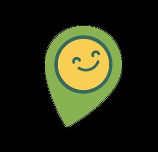 Green map location pin with a happy yellow smiling face inside
